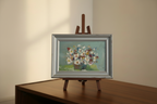 Floral painting on easel with Farrow & Ball Skimming Stone walls